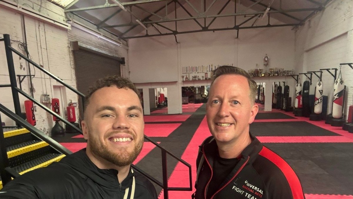Donovan Wint with a martial arts school owner